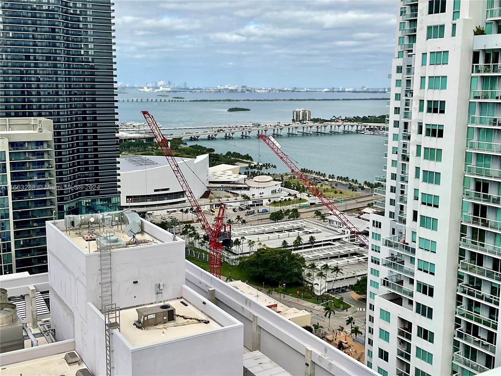 Taken from the rooftop pool, the two tower cranes at work on the Waldorf Astoria Hotel&Residences tower project