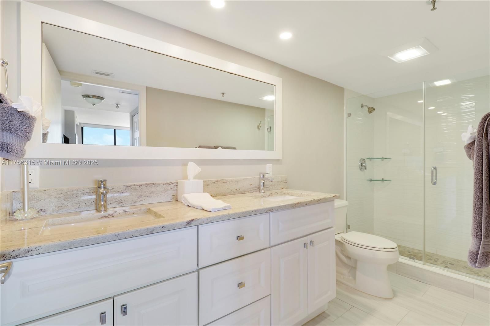 Primary Bathroom featuring dual sinks