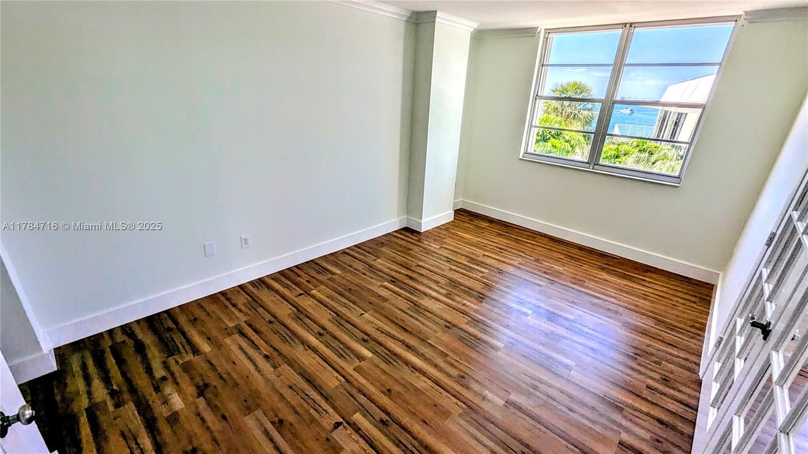 Spacious third bedroom with french doors